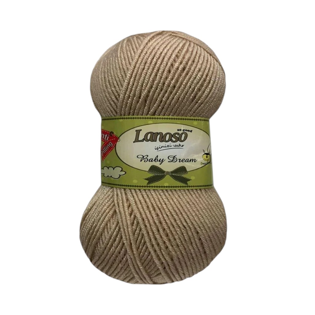 Beige skein of Lanoso Baby Dream yarn with a green label wrapped around it