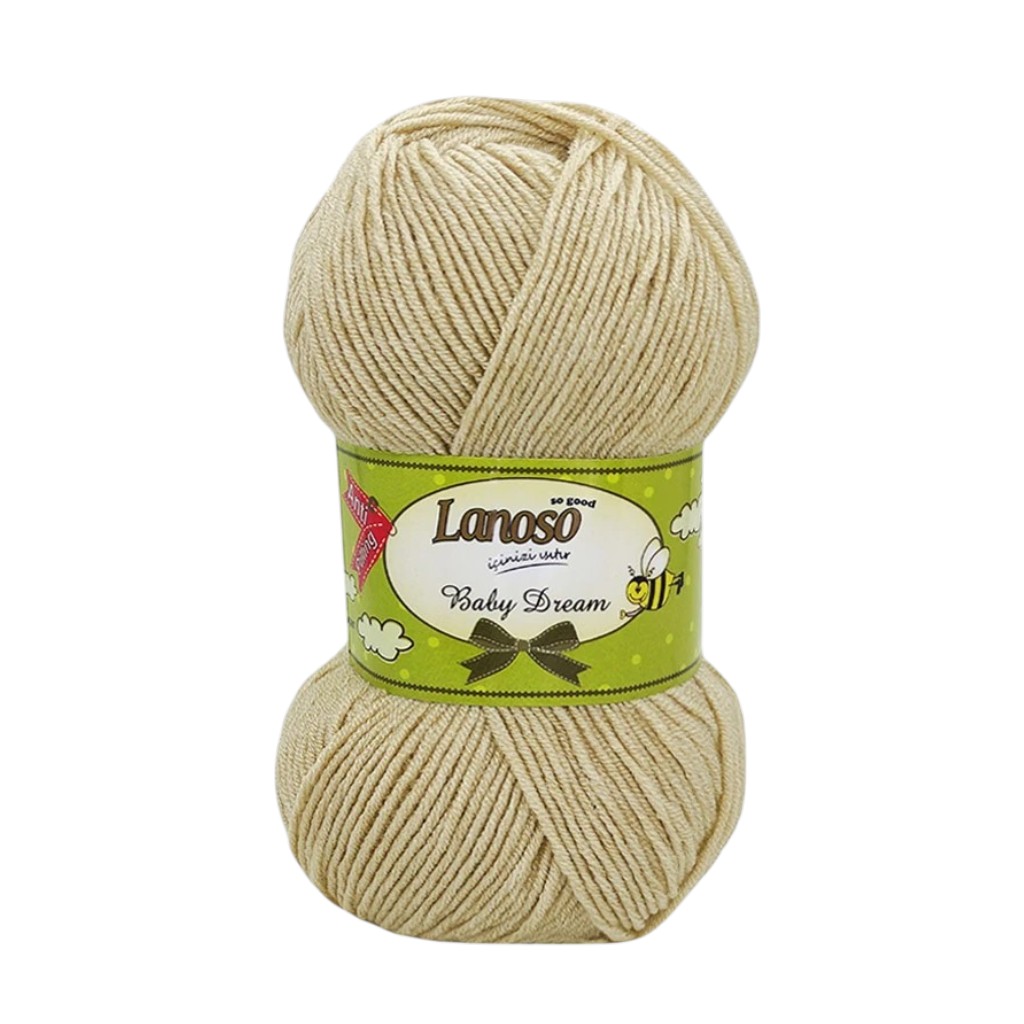 Beige skein of Lanoso Baby Dream yarn with a green label on top and bottom ends visible